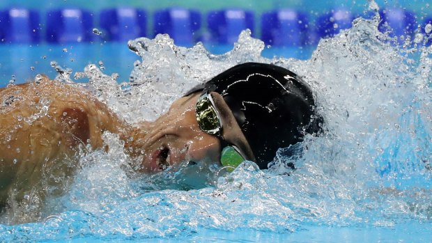 Michael Phelps' teammate lent him a cap and inverted it to hide the logo of Speedo, a rival of Phelps' sponsor, Aqua Sphere.