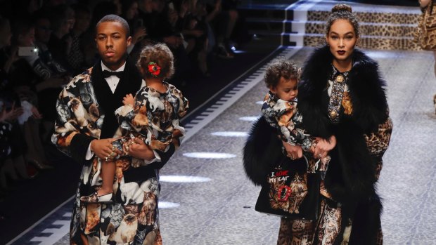Model Amanda Harwey and her husband Jason Harwey and their sons Noah, right, and Rose, wear creations for Dolce&Gabbana women's Fall-Winter 2017-18 collection, in Milan, Italy, 