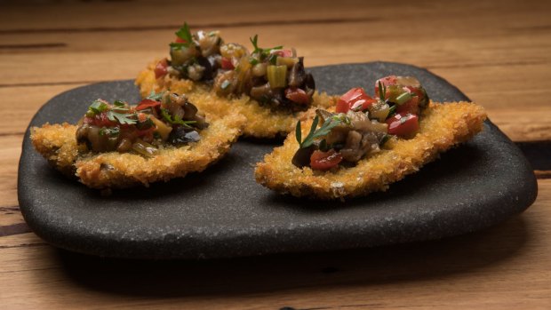 Crumbed butterflied sardines with eggplant caponata.