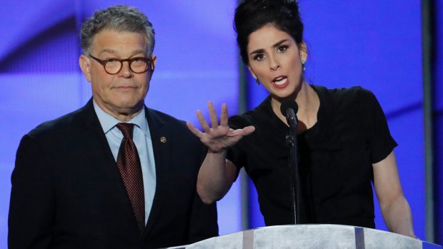 Sarah Silverman speaks with Senator Al Franken during the first day of the Democratic National Convention.