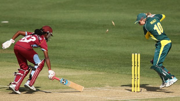 Shaquana Quintyne is found short of the crease by Australia's Alyssa Healy.
