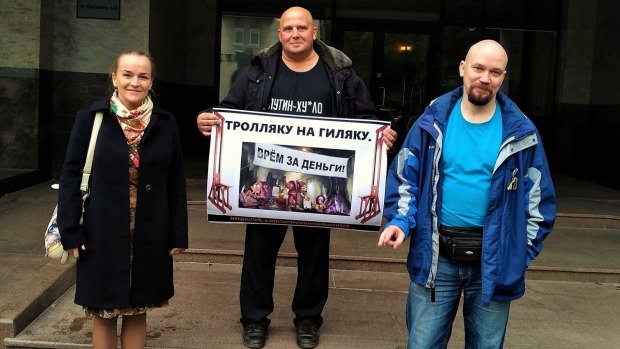 Diana Retsinka and other Russian activists protesting over the activities of so-called troll farms in St Petersburg on October 2.