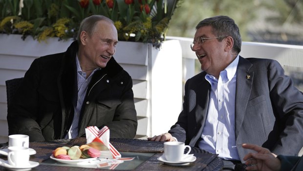 Laughing to Rio: Russian President Vladimir Putin, left, and IOC President Thomas Bach at the 2014 Winter Olympics in Sochi.