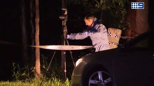 Police investigate the scene of an alleged murder at Delaneys Creek, north of Brisbane.