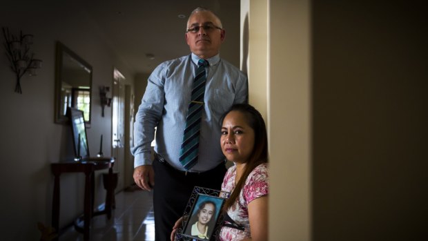 Philip and Arlen Rankin with a photo of their daughter Angelica, now 26, who they have decided to relinquish to the care of the state. 