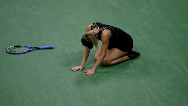 Maria Sharapova drops to her knees after defeating Simona Halep in the first round of the US Open.