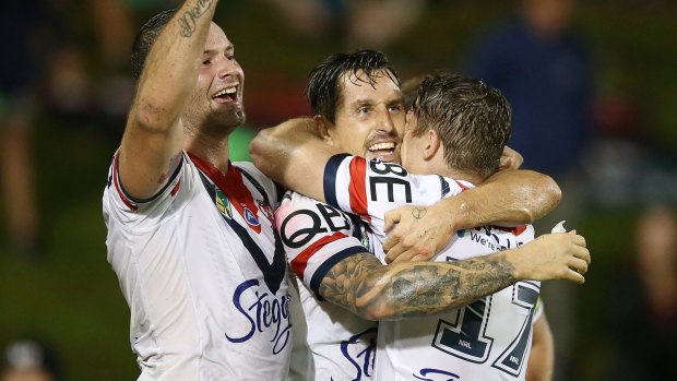 Controversial: Boyd Cordner and Mitchell Pearce of the Roosters celebrate a try against the Panthers.