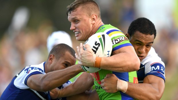 Wrapped up: The Bulldogs defence gets busy against the Raiders on the Sunshine Coast.