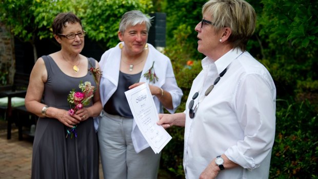 Anne-Marie Delahunt, centre, with her partner Margaret Penrose Clark and marriage celebrant Judy Aulich at their wedding in Canberra on December 9, 2013. The High Court later invalidated their marriage. 