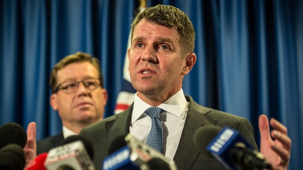 NSW Premier Mike Baird and former deputy premier Troy Grant were stunned by angry and economically fearful voters in Orange.