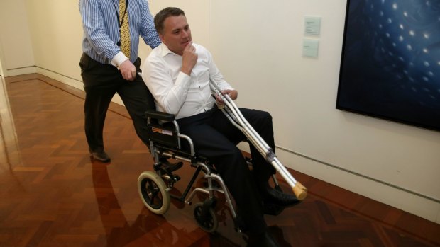 Assistant Infrastructure Minister Jamie Briggs emerged in a wheelchair after a wild party in the Prime Minister's suite. 