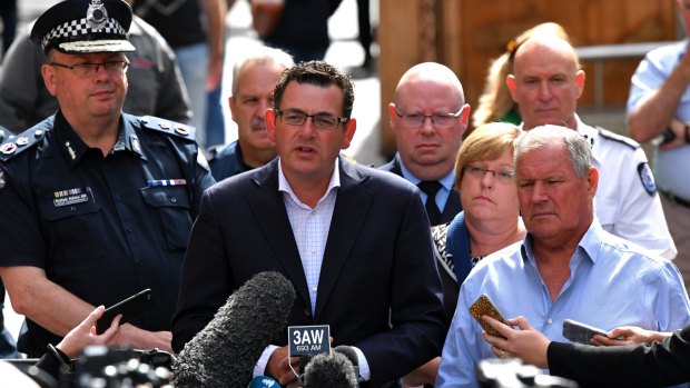 Chief Commissioner Graham Ashton, Premier Daniel Andrews, and lord mayor Robert Doyle address the media. 