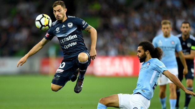 James Troisi and Osama Malik of City (right) contest for the ball during the Melbourne derby.