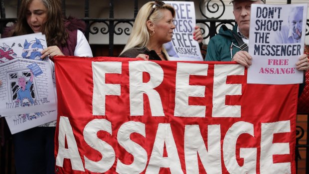 Supporters of WikiLeaks founder Julian Assange stand outside the Ecuadorian embassy.