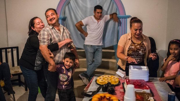 Carlos Saldana, second from left, at his grandson's birthday party in Xalapa. 