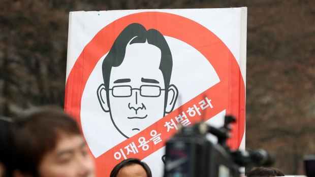 Protesters outside the Seoul Central District Court where Lee appeared in Janaury.  