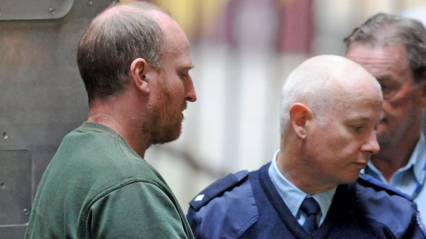 Stephen Bailey (left) is lead into the Supreme Court in Melbourne on Thursday.