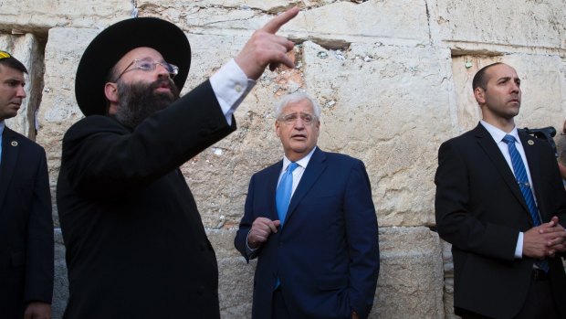 US ambassador to Israel David Friedman, centre, visits the Western Wall on Monday. He presented his credentials to Israeli President Reuven Rivlin on Tuesday.