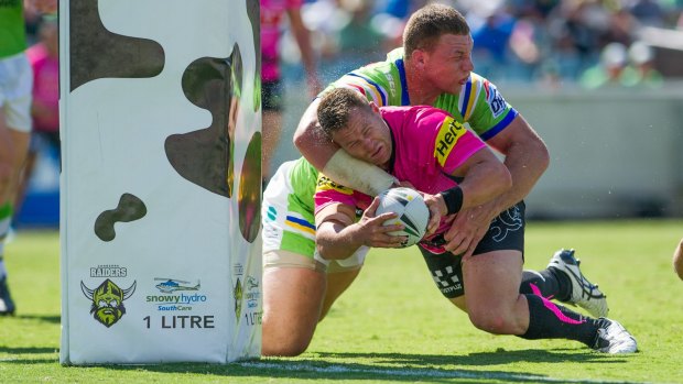 The forgotten man: Panthers forward Trent Merrin scores a try.