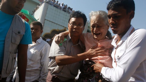 Tin Tin Aye, second from right, mother of Ko Ni, cries as she attends his funeral.