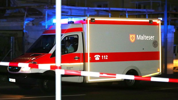 An ambulance stands at a road block in Wuerzburg, southern Germany, on Monday.