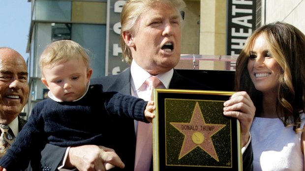 Donald Trump with his wife, Melania, and their son, Barron, pose for a photo after he was given a star on the Hollywood Walk of Fame in Los Angeles in 2007.
