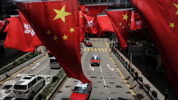 Chinese and Hong Kong flags are displayed on the streets to mark the 20th anniversary of the territory's handover from Britain to China. 