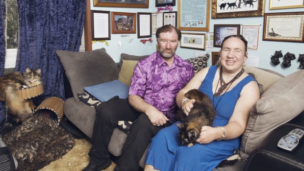 Mark and Maria Slater with their cats in their Leura home.