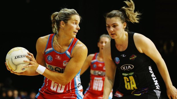 Rebounding: Diamonds defender Julie Corletto (left) in action with the Swifts.
