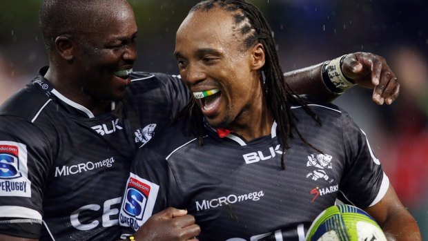 Super try: Lubabalo Mtembu, left, celebrates after his Sharks teammate Odwa Ndungane scored a try against the Lions in Durban. 