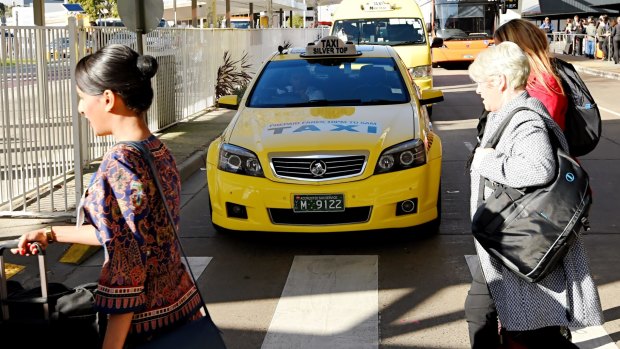Taxi drivers are angry about the decision to allow UberX wait-zones at Melbourne Airport.