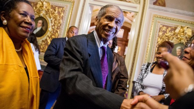 Loretta Lynch's father, Lorenzo Lynch, center, accompanied by Democrat representative Sheila Jackson Lee, on Thursday.