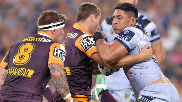 Epic clash: Jason Taumalolo of the Cowboys attempts to break the Brisbane defence.
