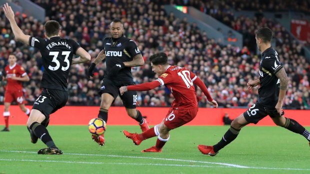 Final flourish: Philippe Coutinho scores against Swansea City on Boxing Day.