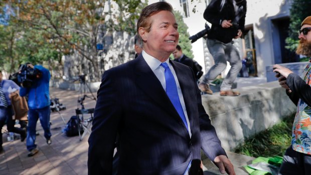 Trump said there was no mention of him in the charges against former campaign manager Paul Manafort, pictured leaving a federal court in Washington on Monday. 