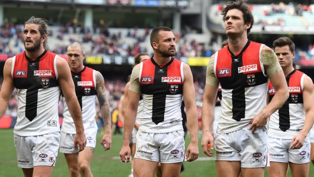 Hard yards: Saints players leave the ground after loss to Dees.