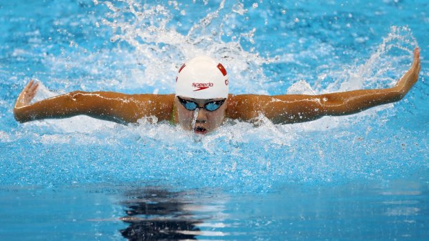 Xinyi Chen of China competes in heat four of the Women's 100m Butterfly.