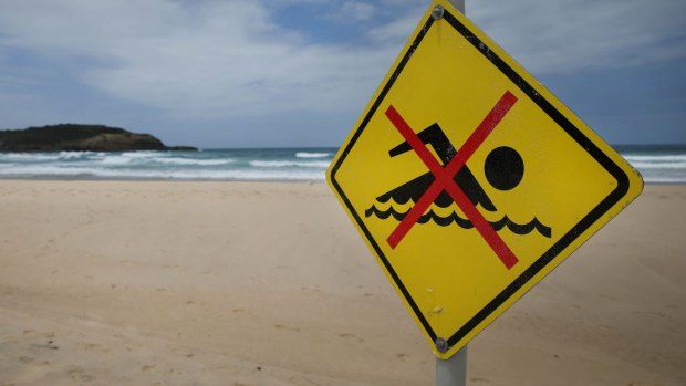 Warning signs at Frazer Beach.