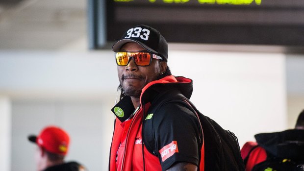 On notice: Chris Gayle arrives at Melbourne Airport on Tuesday after his night of controversy in Hobart.