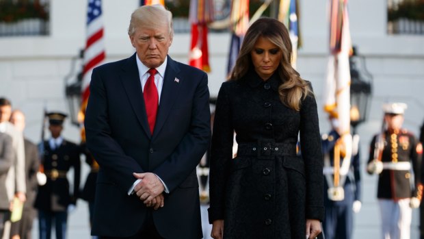 US President Donald Trump and first lady Melania Trump during a moment of silence on the South Lawn of the White House to mark the anniversary of the September 11 terrorist attacks.