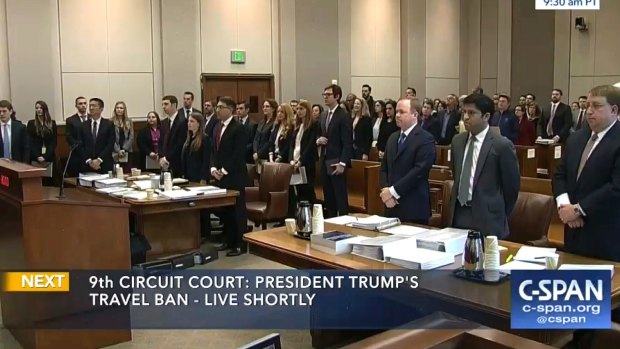 Participants and members in the gallery stand as three judges for the 9th US Circuit Court of Appeals enter the room in Seattle earlier this month. 