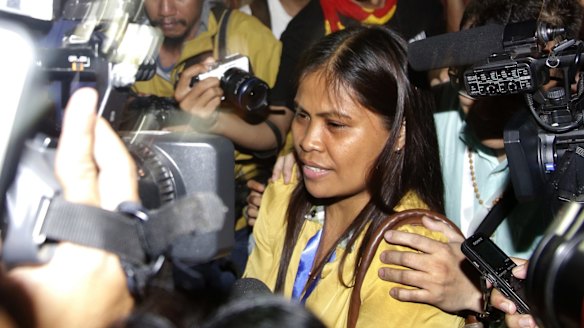 Marites Veloso, Mary Jane Veloso's sister, surrounded by media after visiting her sister on Wednesday.