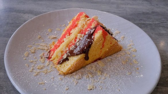 Pizze dolce - sponge layered with syrup, dark chocolate custard and toasted almonds.