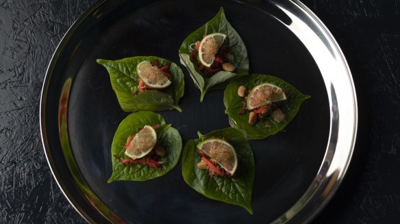 Betel leaves with sweet pork, dried shrimp and macadamia.