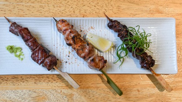 Trio of yakitori (chicken skewers).