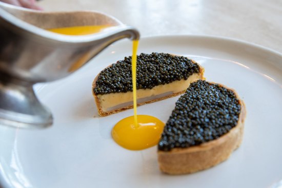 Caviar and scallop mousseline pie with citrus butter.