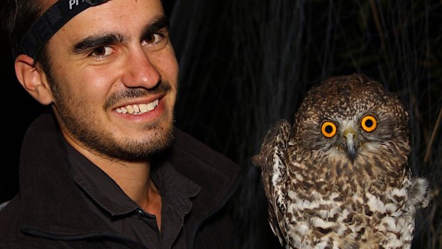 Nick Bradsworth with a captured powerful owl.