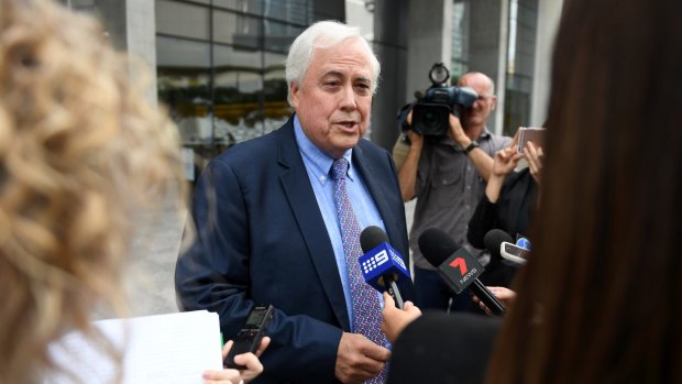 Clive Palmer speaks to media after his court appearance earlier this month.