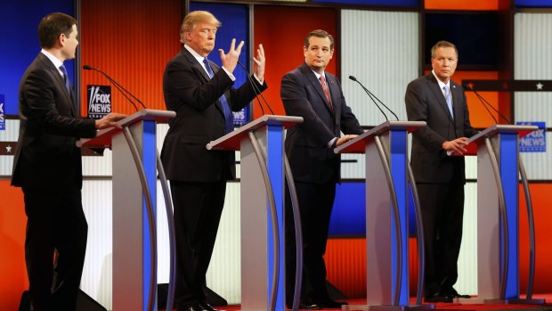 Republican presidential candidate Donald Trump, second from left, shows his hands during Thursday's Republican debate while Marco Rubio (left), Ted Cruz and John Kasich look on. 