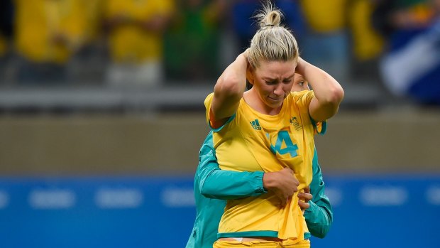 Alanna Kennedy is comforted after missing the final penalty in the Matildas' loss to Brazil.
